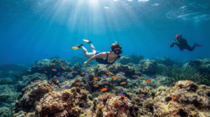 underwater travel photograph in the crystal-clear Cretan Sea, Greece, adult snorkeler exploring rocky Mediterranean