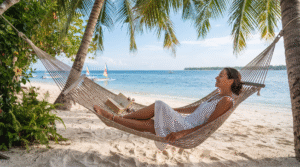 hammock beneath coconut palms on a quiet Gili Air beach, open book beside her, turquoise sea and white sand in the background,