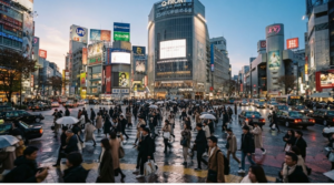 professional street photography of Shibuya Crossing in Tokyo, Japan during early evening, massive pedestrian crossing filled with diverse real adult people naturally walking in different directions,