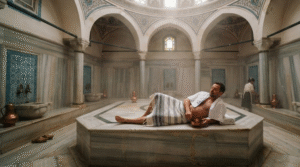 atmospheric interior photograph of a historic Turkish hammam in Istanbul, Turkey, elegant marble architecture with domed ceiling,