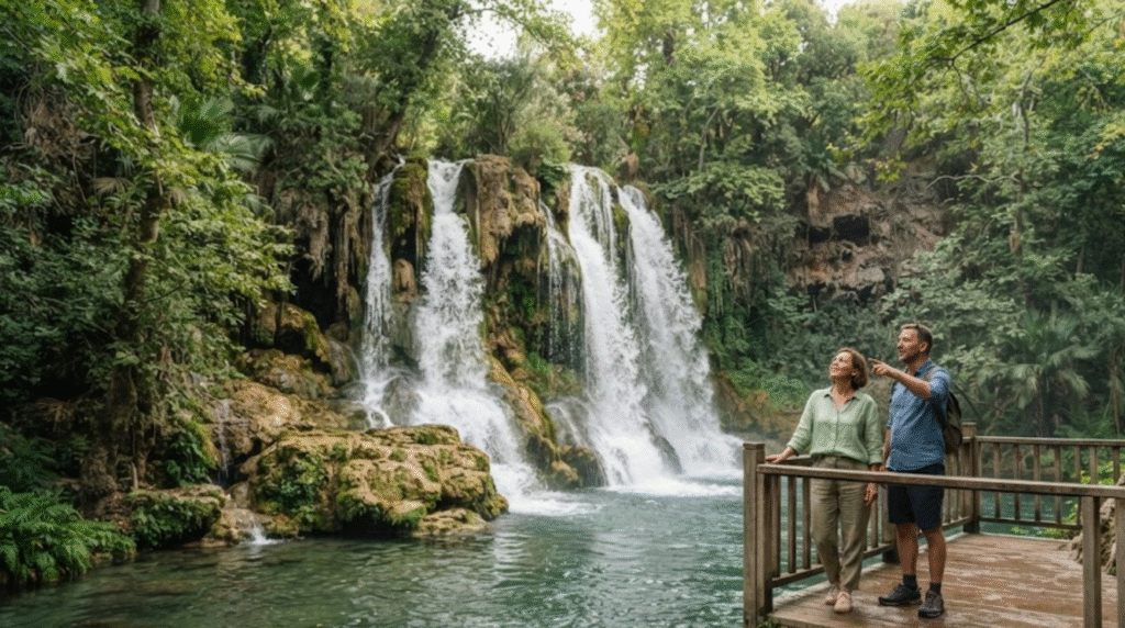 nature travel photograph of Upper Düden Waterfalls near Antalya, Turkey, powerful waterfall cascading over layered limestone rocks into a clear natural pool,