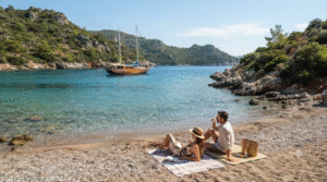 beach lifestyle photograph of a secluded bay near Bodrum, Turkey, crystal-clear turquoise Aegean water surrounded by rugged green hills
