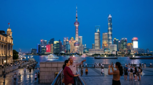 travel photograph of the Oriental Pearl Tower in Shanghai, China, iconic tower rising above the Pudong skyline beside the Huangpu River,
