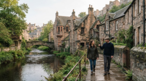 travel photograph of Dean Village in Edinburgh, Scotland, authentic historic stone cottages and buildings beside the Water of Leith, small stone bridge