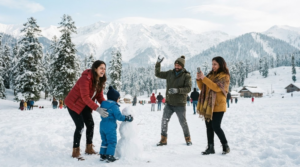 travel photograph in Kashmir showing random diverse Indian tourists enjoying fresh snow in a Himalayan mountain destination, surrounded by snow-covered trees and dramatic peaks