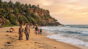travel photograph of Varkala Beach, Kerala, featuring dramatic laterite cliffs overlooking the Arabian Sea, a wide sandy beach and lush tropical vegetation.